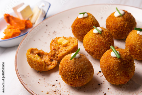 Traditional spanish croquettes from mallorca with sobrassada and cheese