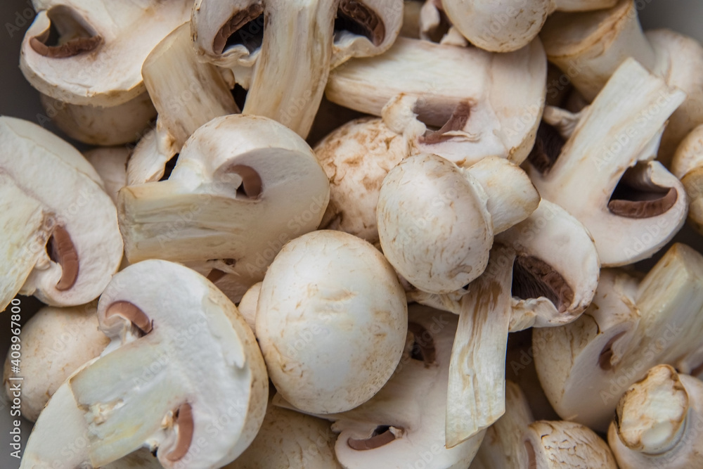 Whole and sliced fresh mushrooms and champignons Whole and sliced fresh mushrooms and champignons