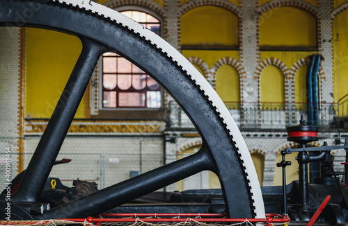 Fototapeta Naklejka Na Ścianę i Meble -  Old steam machine, steam pump wheel. Industrial historic heritage