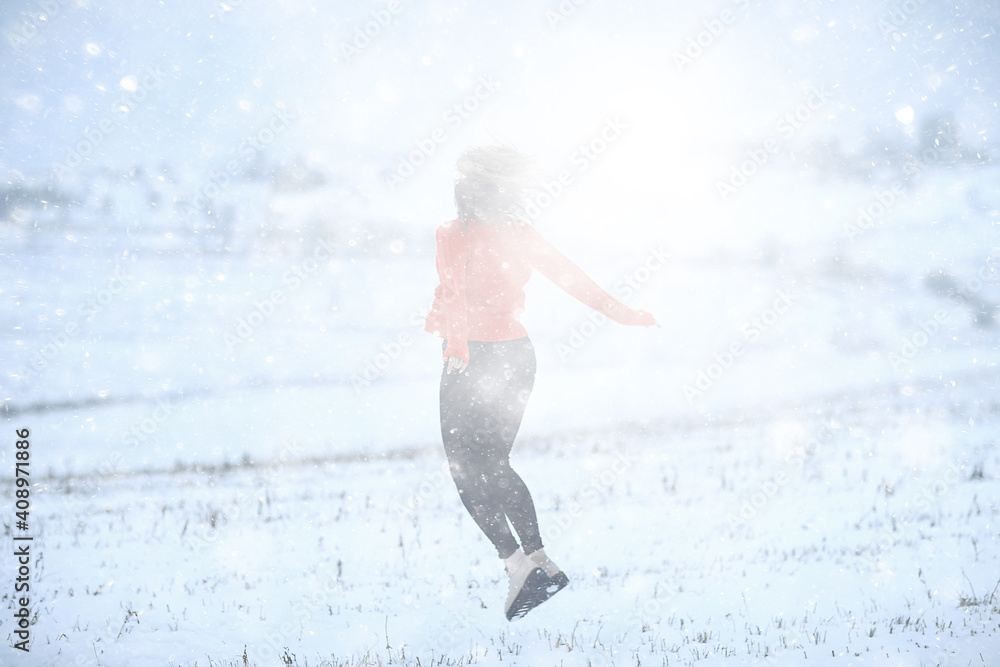 winter snow field woman happiness jumping and running in the field, new year holidays vacation freedom concept