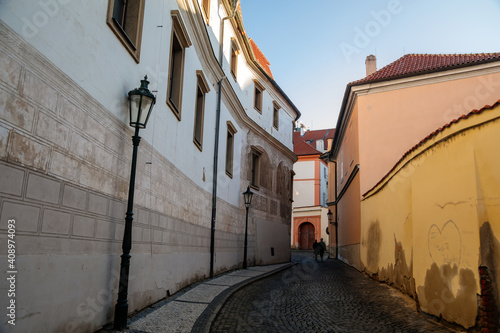 Beautiful renaissance house, facade is richly decorated with figural sgraffito, Martinic Palace at Hradcany Square nearby Prague Castle, sunny winter day, Prague, Czech Republic photo