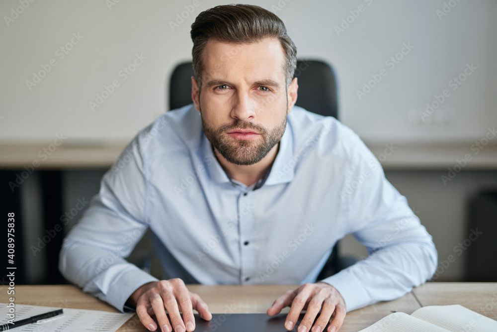 Man leaning forward while trying to notice something Man leaning forward while trying to notice something