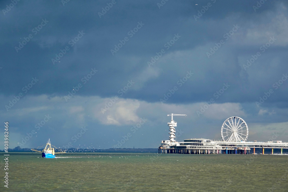 The Pier of Scheveningen and a fishermen boat