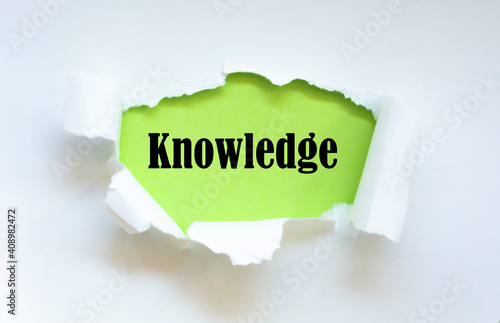 Knowledge text on paper. Word knowledge on torn paper. Concept Image.
