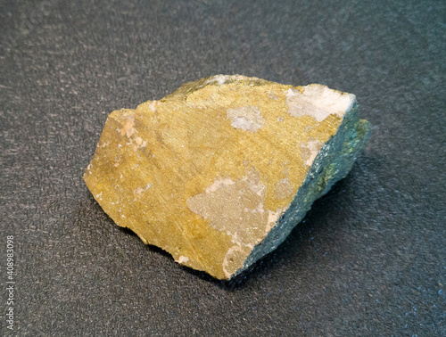 the mineral is a stone chip with yellow inclusions