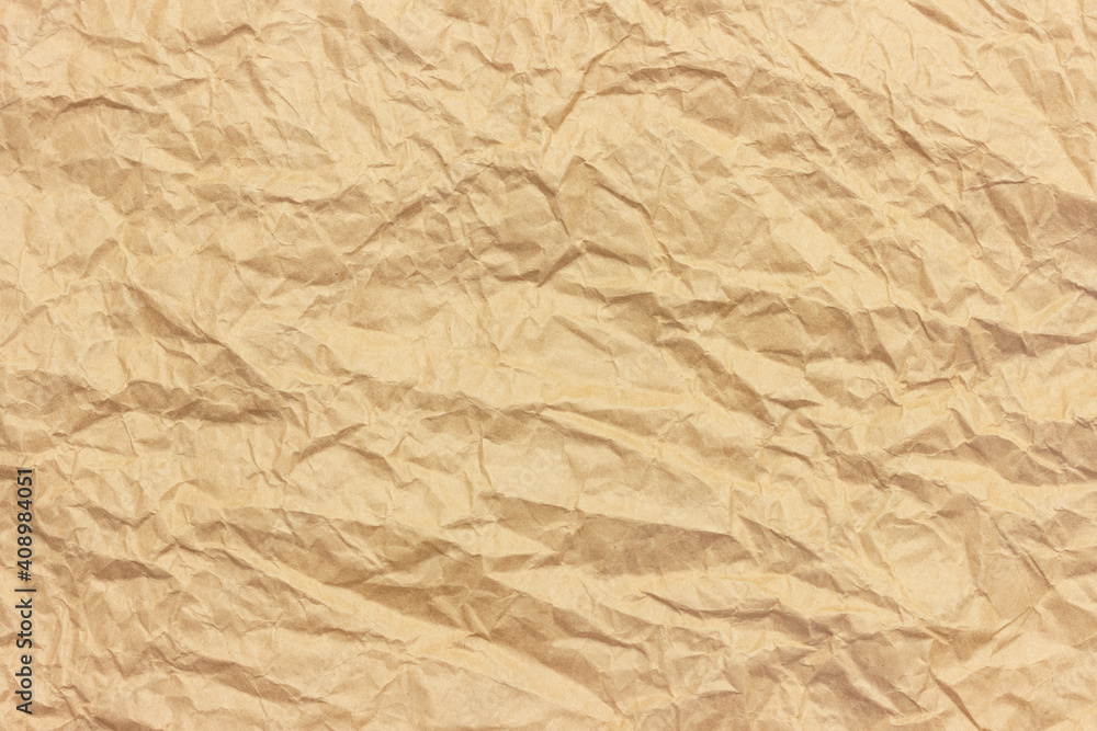 The texture of crumpled brown craft paper. The texture of crumpled brown craft paper.