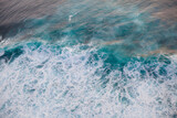 Deep blue stormy sea water surface with white foam and waves pattern, background photo texture