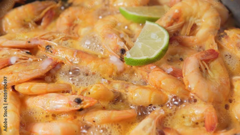 big tiger prawns roasted with lime and sea salt. close up selective focus big tiger prawns roasted with lime and sea salt. close up selective focus
