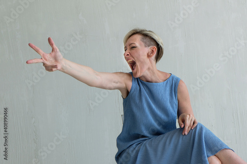 mid adult woman posing emotion in studio photo