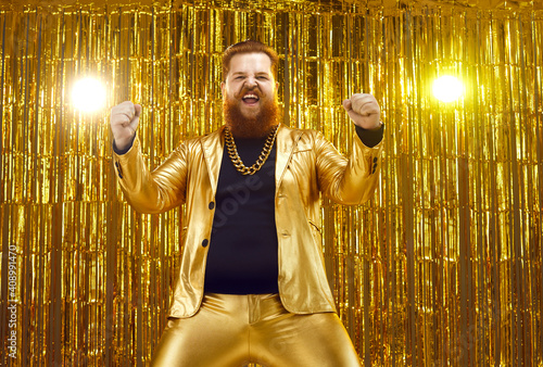 Bild auf Leinwand Happy crazy funky uninhibited ginger young man wearing funny golden suit and ext