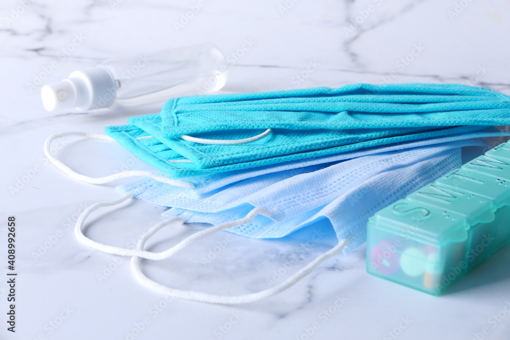 Close up of, pills and surgical masks on table 