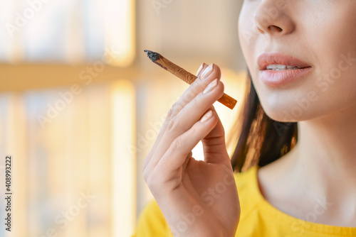 Young woman smoking cigaret...