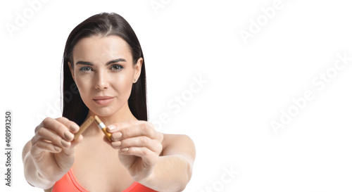 Sporty young woman breaking...