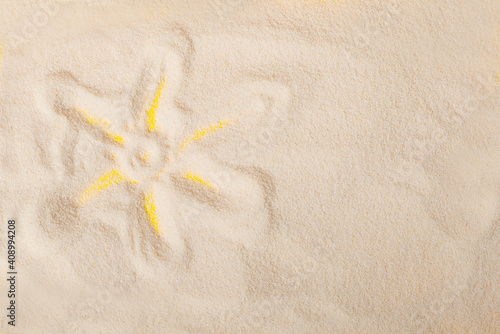 simple sun drawing in the sand on the beach  room for your copy space