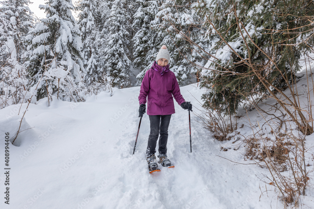 Snow shoeing in fresh snow above the pretty French Alpine village of Les Contamines-Montjoie Snow shoeing in fresh snow above the pretty French Alpine village of Les Contamines-Montjoie