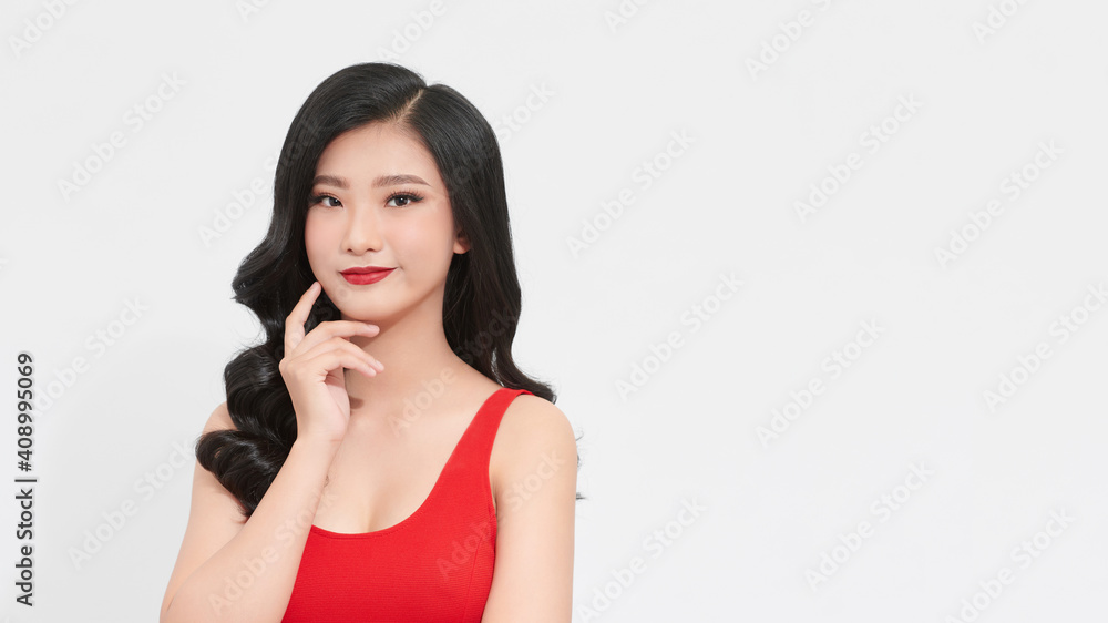 Gorgeous fashion model in bright red dress over white background . Beauty, fashion. Love concept Gorgeous fashion model in bright red dress over white background . Beauty, fashion. Love concept