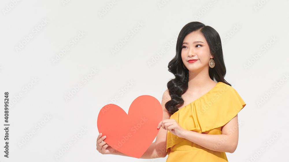 portrait of healthy woman with red heart symbol over white background portrait of healthy woman with red heart symbol over white background