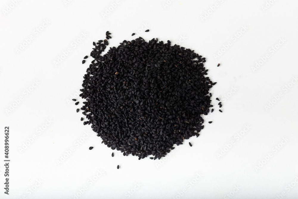 Pile of black seed on white background. Pile of black seed on white background.