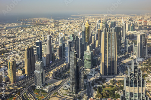 Aerial view of Dubai from Burj Khalifa - tallest skyscraper in the world. DUBAI, United Arab Emirates. 