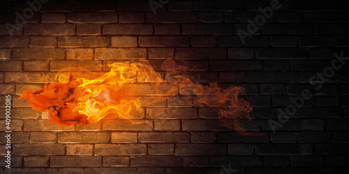 Fire against stone brick wall