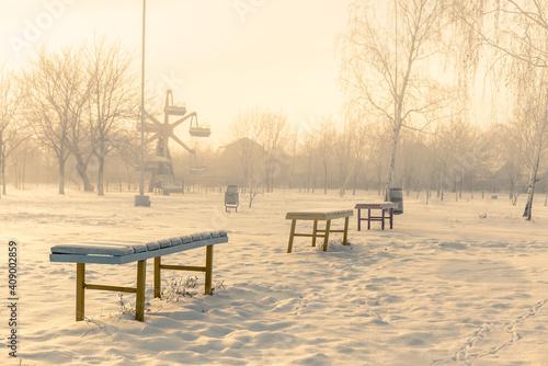 Park benches in the early winter morning. © Valerii
