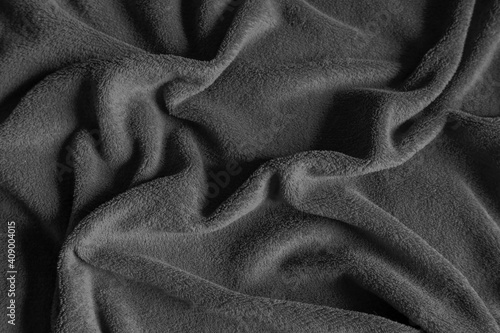 grey satin textile with wrinkles background. Top view. Copy space