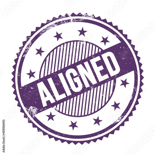 Fényképezés ALIGNED text written on purple indigo grungy round stamp.