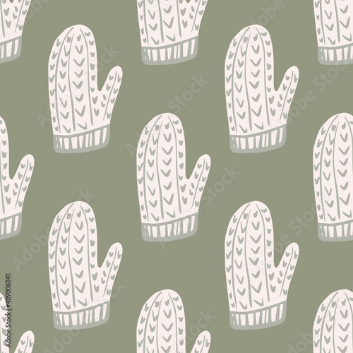 Pale tones seamless pattern with white winter ornament mittens shapes. Grey background. Xmas backdrop.
