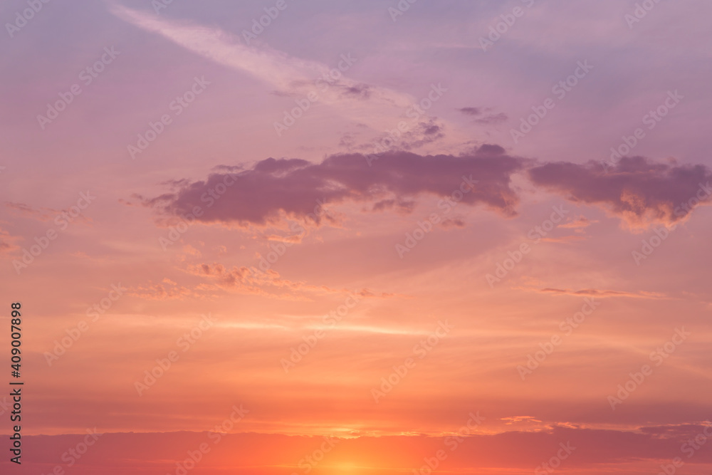 Sunrise, sunset pink violet orange blue sky with sun and sunlight, cirrus clouds background texture 
