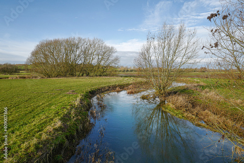 River Tove in Northamptonshire, England, UK on a beautiful sunny day with blue sky in January. photo