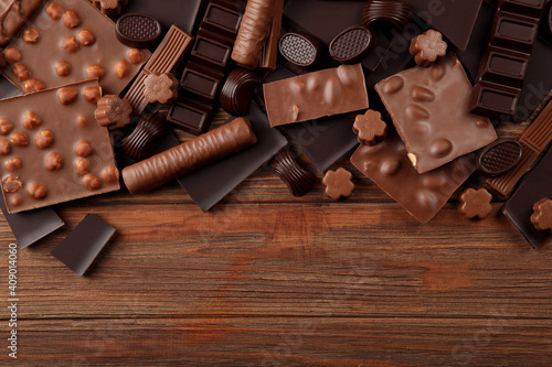 Chocolate products of different types on a colored background close-up with a place for text 