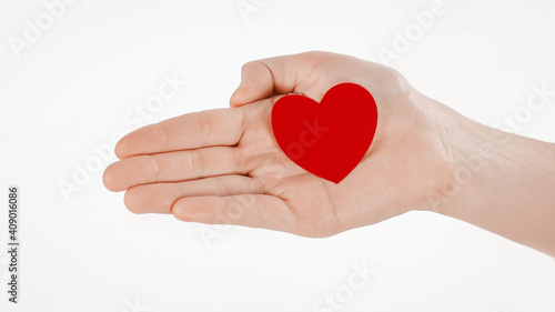close up.paper red heart on the female hand.photo with copy spa