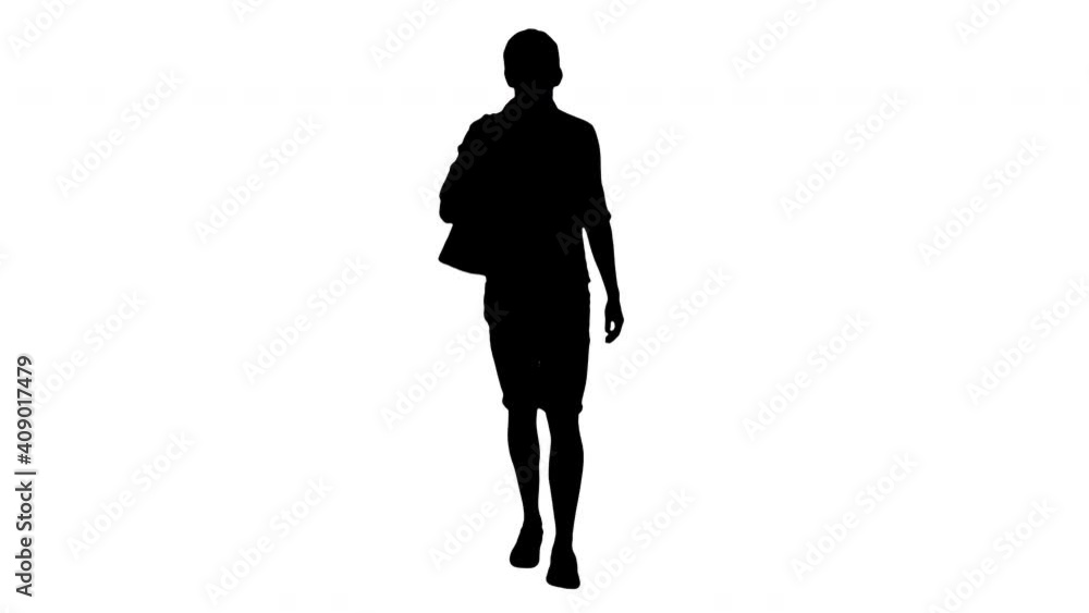 Silhouette Handsome smiling man in white shirt walking with a bag on his shoulder. Silhouette Handsome smiling man in white shirt walking with a bag on his shoulder.