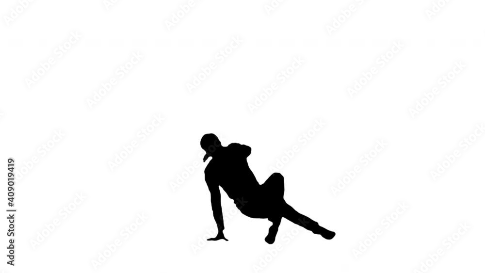 Silhouette Young man dressed in white shirt and black pants dancing break dance. Silhouette Young man dressed in white shirt and black pants dancing break dance.