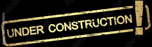 gold stamp with text under construction