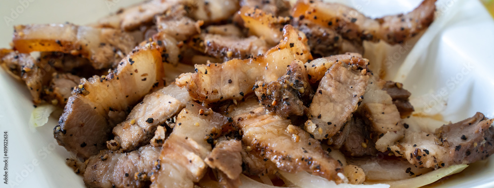 Delicious Taiwanese salted pork food with onion in restaurant. Delicious Taiwanese salted pork food with onion in restaurant.