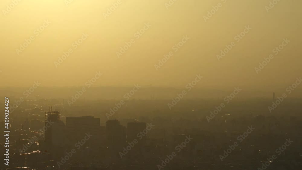 TOKYO, JAPAN : Aerial high angle sunrise CITYSCAPE of TOKYO and MOUNT FUJI. Huge sun rising behind mountains. Japanese city life and nature concept. Long time lapse zoom in shot night to morning. TOKYO, JAPAN : Aerial high angle sunrise CITYSCAPE of TOKYO and MOUNT FUJI. Huge sun rising behind mountains. Japanese city life and nature concept. Long time lapse zoom in shot night to morning.