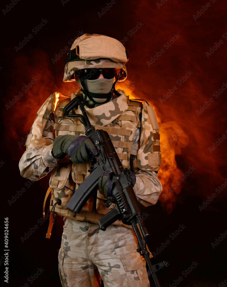 a soldier on fire holding a gun. Fight against terrorism a soldier on fire holding a gun. Fight against terrorism