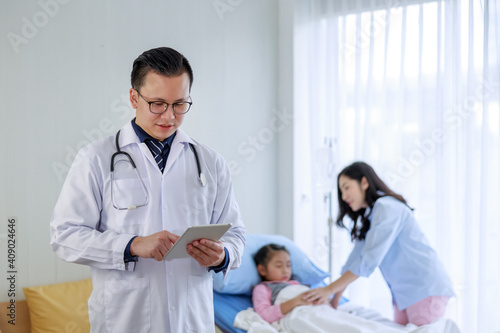 Doctor Working With Digital Tablet