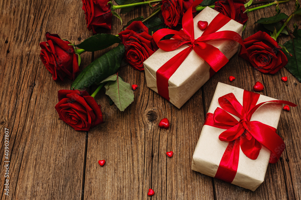 Valentine greeting card background with gift boxes, fresh burgundy roses and assorted hearts Valentine greeting card background with gift boxes, fresh burgundy roses and assorted hearts