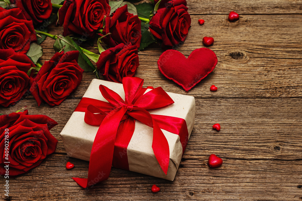 Fototapeta premium Valentine greeting card background with gift boxes, fresh burgundy roses and assorted hearts