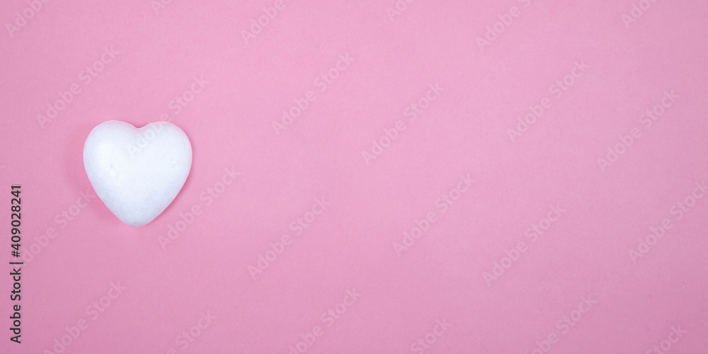 One little white heart on a pink background