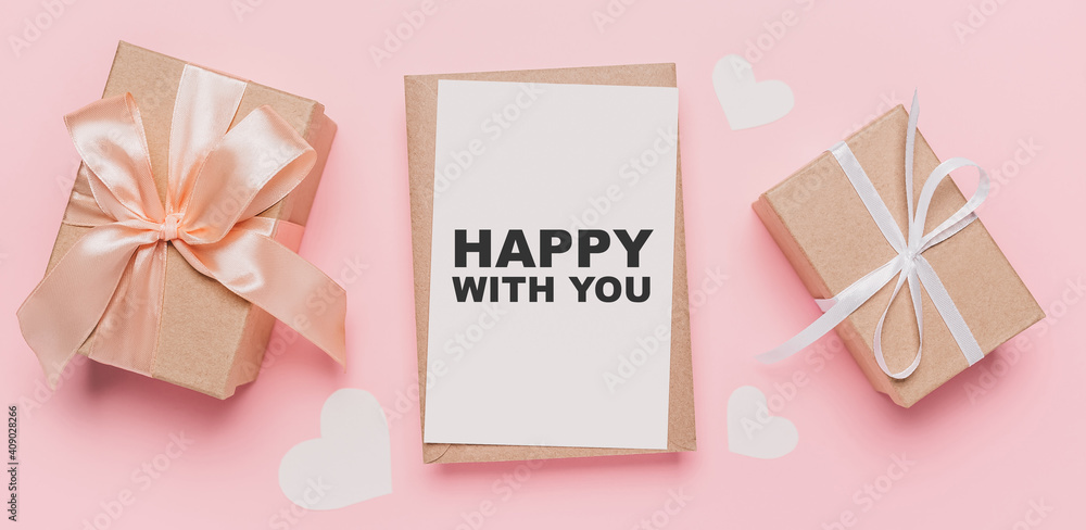 Gifts with note letter on isolated pink background, love and valentine concept with text happy with you