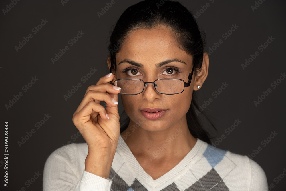 Headshot of beautiful Asian Indian woman with glasses. Headshot of beautiful Asian Indian woman with glasses.