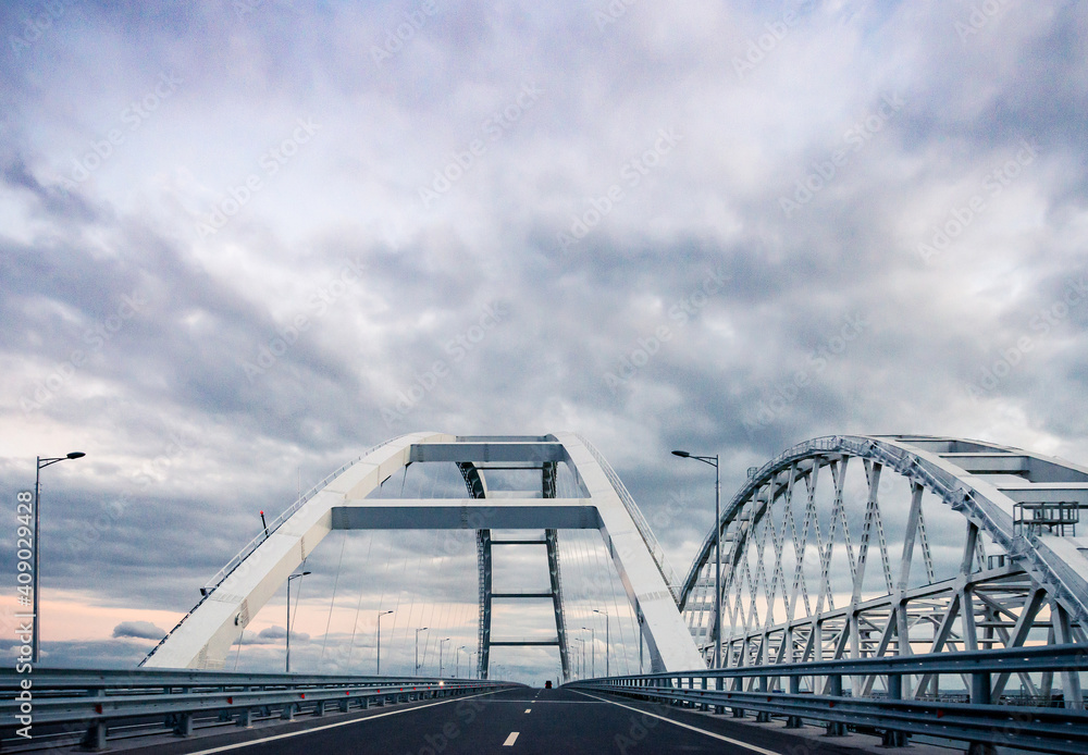 Obraz premium the Car rides on the road bridge connecting the banks of the Kerch Strait between Taman And Kerch. Crimean bridge October, 2018