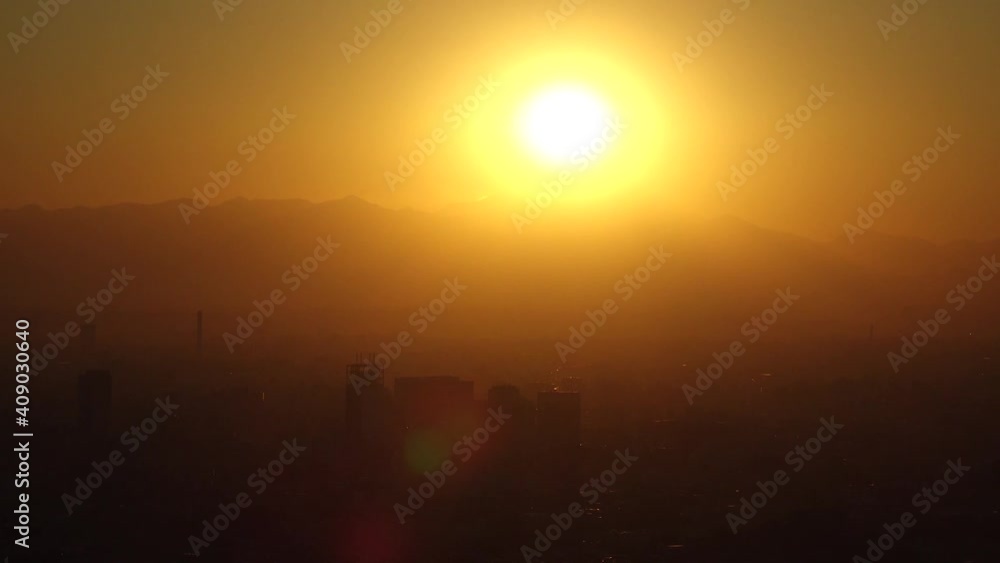 TOKYO, JAPAN : Aerial high angle sunset CITYSCAPE of TOKYO and MOUNT FUJI. Huge golden sun sinking behind mountains. Japanese city life and nature concept. Long time lapse shot dusk to night. TOKYO, JAPAN : Aerial high angle sunset CITYSCAPE of TOKYO and MOUNT FUJI. Huge golden sun sinking behind mountains. Japanese city life and nature concept. Long time lapse shot dusk to night.