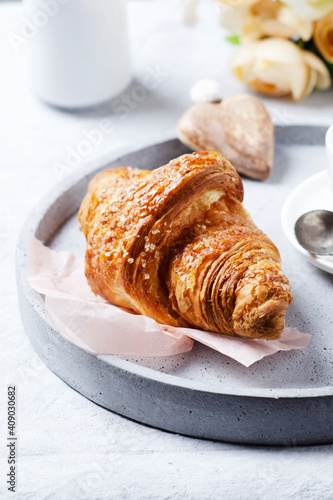 Morning  romantic coffee  croissant on light grey tray for Valentine romantic gift concept.