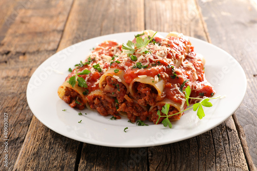canelloni- pasta with minced beef, tomato sauce and cheese