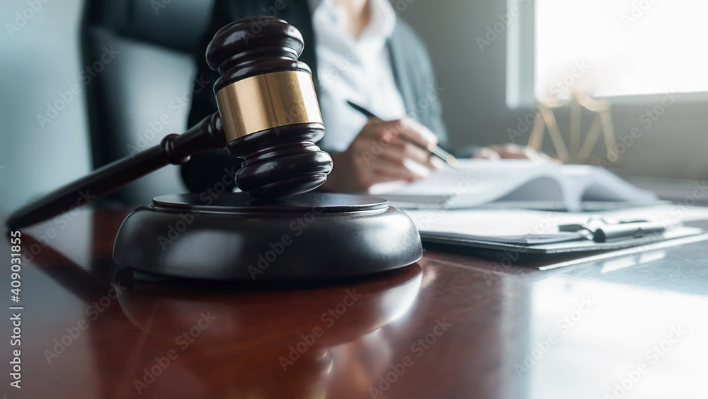 udge gavel with Justice lawyers having team meeting at law firm background. Concepts of Law and Legal services. udge gavel with Justice lawyers having team meeting at law firm background. Concepts of Law and Legal services.