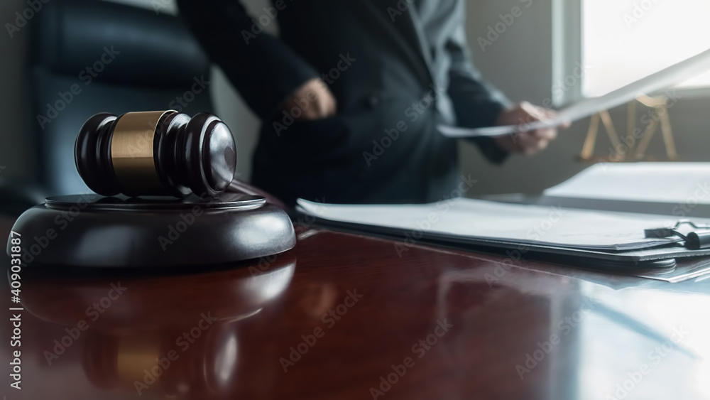 udge gavel with Justice lawyers having team meeting at law firm background. Concepts of Law and Legal services. udge gavel with Justice lawyers having team meeting at law firm background. Concepts of Law and Legal services.